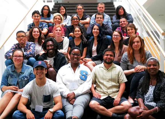 Group of people sit ting on stairs for picture